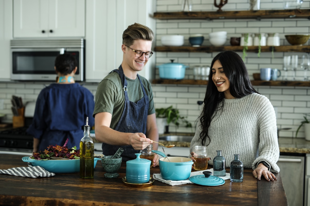 Family preparing a Caribbean meal together in a warm kitchen