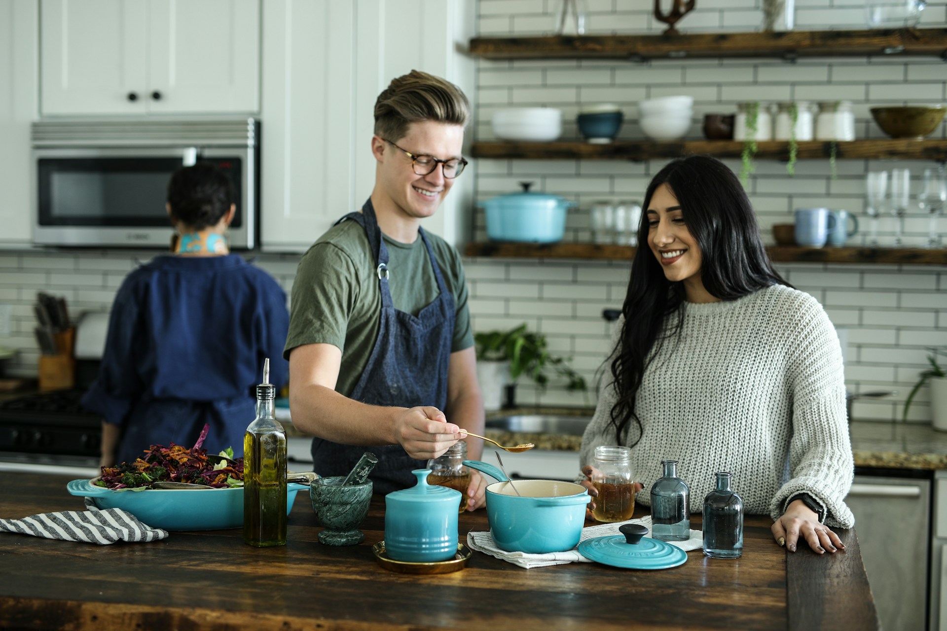 Family cooking with fresh ingredients in a warm kitchen